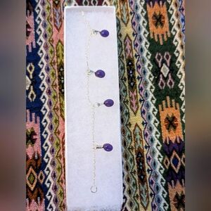 Purple hand crafted artisan made glass charm bracelet with silver plate.